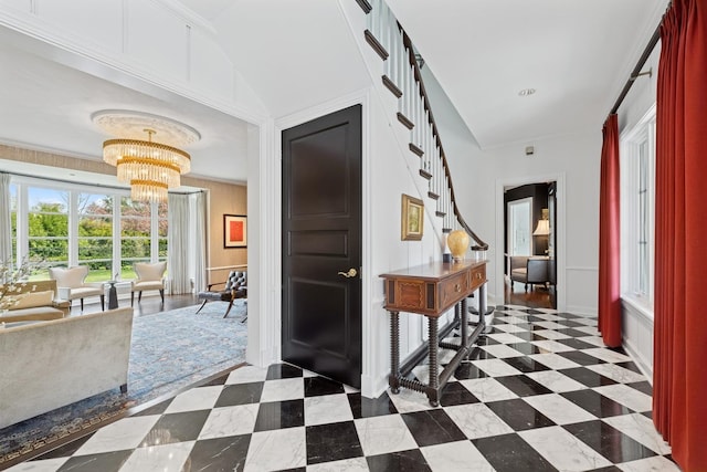 foyer featuring a chandelier