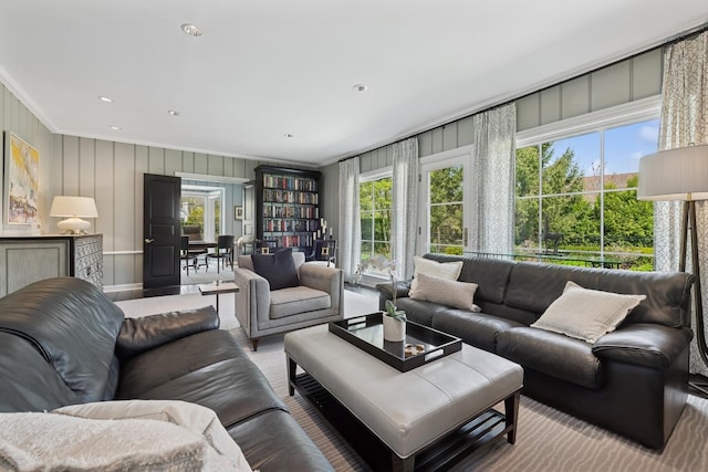 living room featuring crown molding