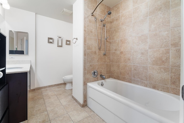 full bath featuring toilet, vanity, baseboards, tile patterned floors, and shower / bathtub combination