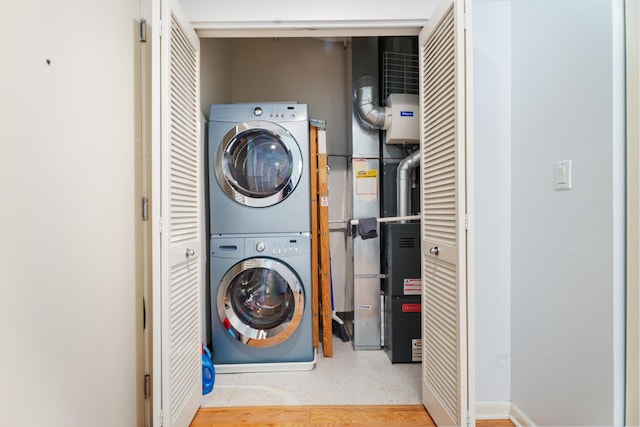 laundry room featuring stacked washer / dryer