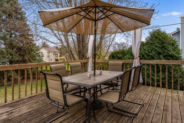 wooden terrace with outdoor dining space