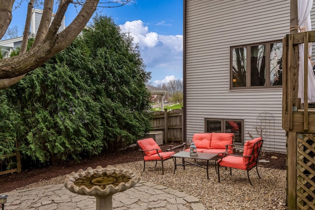 view of patio / terrace featuring fence and an outdoor hangout area