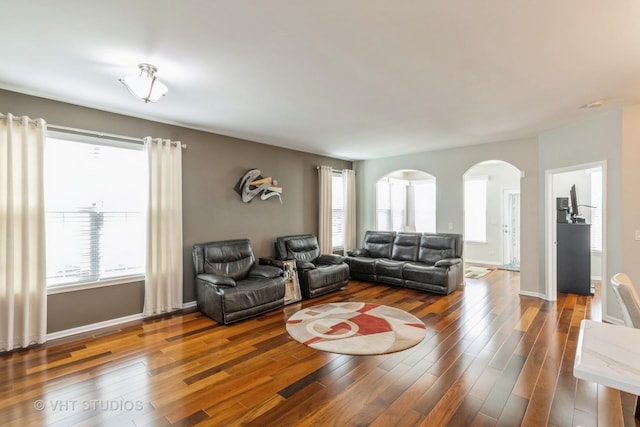 1674 Francis Dr, Pingree Grove, IL 60140 - living area featuring arched walkways, wood finished floors, and baseboards