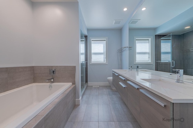 bathroom with visible vents, double vanity, toilet, a sink, and a stall shower