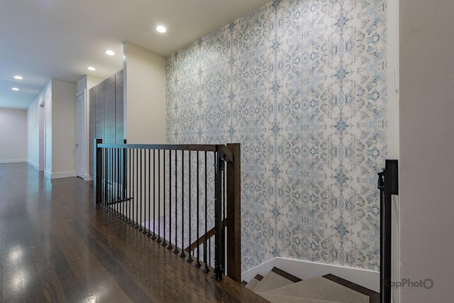 stairway featuring baseboards, recessed lighting, and wood finished floors