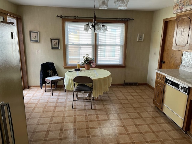 7236 W Olive Ave, Chicago, IL 60631 - dining area featuring baseboards, an inviting chandelier, visible vents, and light floors