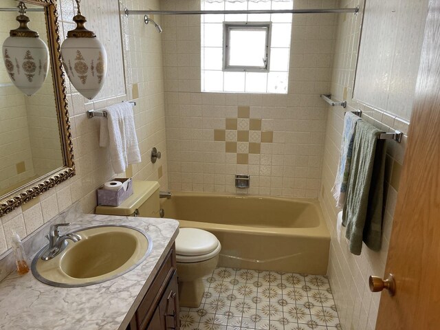 7236 W Olive Ave, Chicago, IL 60631 - full bathroom featuring vanity, toilet, tile patterned floors, tile walls, and  shower combination