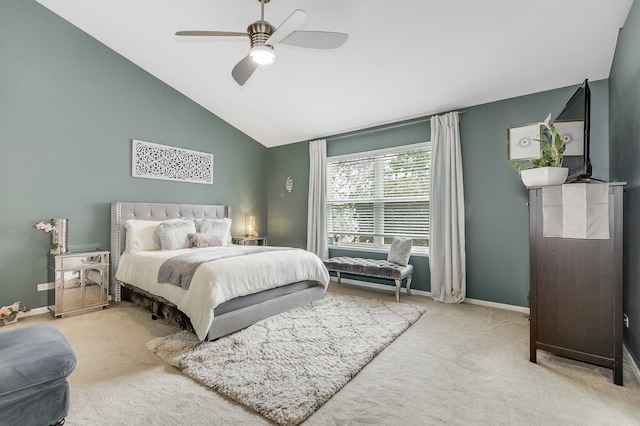 bedroom featuring baseboards, carpet flooring, and lofted ceiling