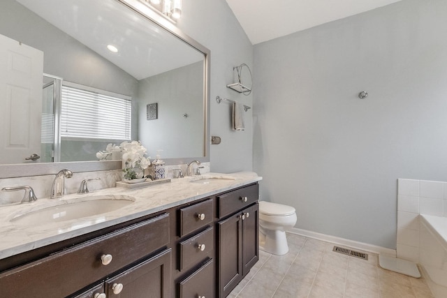 bathroom featuring visible vents, a sink, lofted ceiling, and tiled bath
