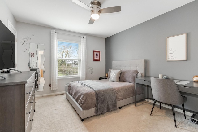 bedroom featuring light colored carpet, a ceiling fan, baseboards, and visible vents