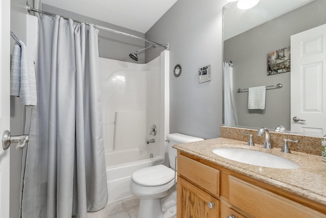 bathroom with vanity, tile patterned flooring, shower / bath combo with shower curtain, and toilet