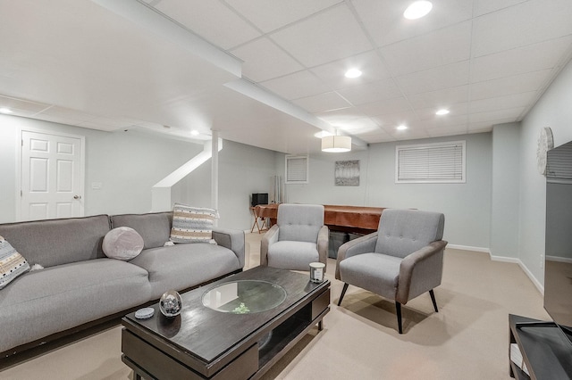 living room featuring recessed lighting, baseboards, light carpet, and a paneled ceiling