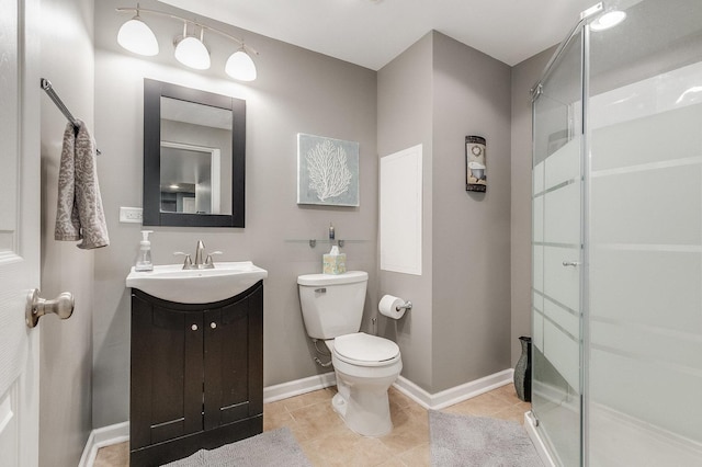 bathroom with vanity, tile patterned flooring, a shower stall, and toilet