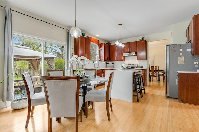dining room with light wood-type flooring