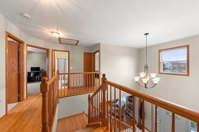 2739 Genoa Dr, New Lenox, IL 60451 - hallway with an upstairs landing, light wood-style floors, and a chandelier