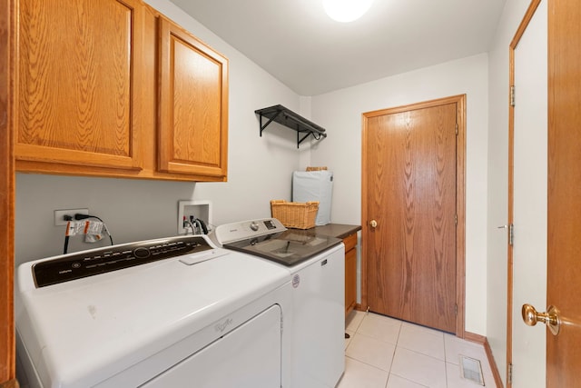 2739 Genoa Dr, New Lenox, IL 60451 - clothes washing area featuring cabinet space, independent washer and dryer, light tile patterned floors, and baseboards