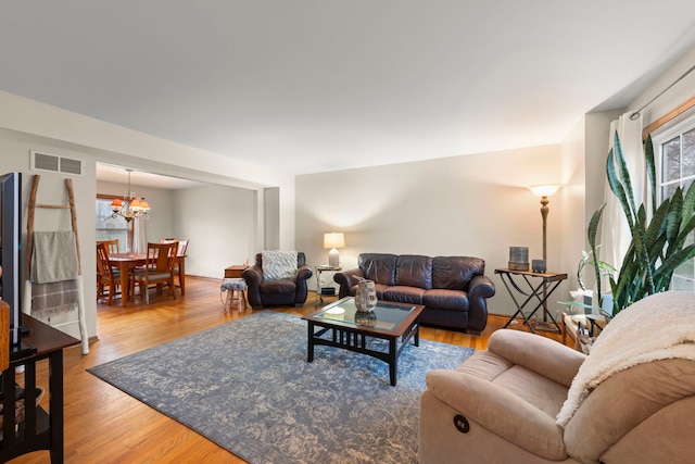 2739 Genoa Dr, New Lenox, IL 60451 - living area with a chandelier and wood finished floors