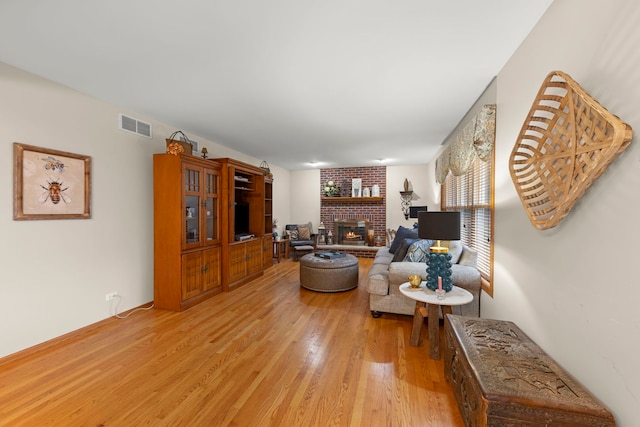 2739 Genoa Dr, New Lenox, IL 60451 - living room with light wood finished floors and a brick fireplace
