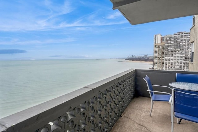 balcony featuring a water view