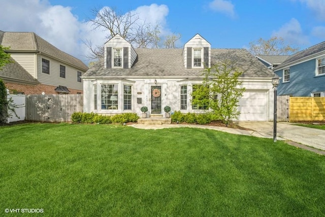 cape cod home featuring fence, an attached garage, concrete driveway, and a front yard