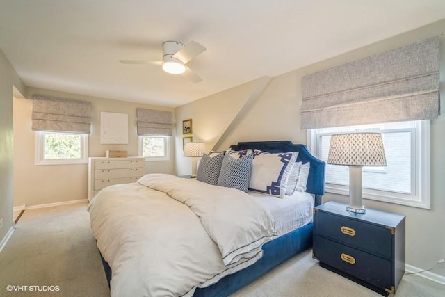 carpeted bedroom with baseboards and ceiling fan