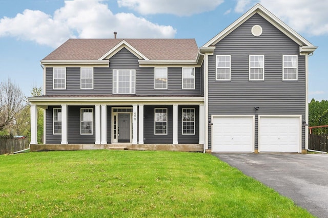 490 Nuthatch Way, Lindenhurst, IL 60046 - view of front of house with a porch, a front yard, a garage, aphalt driveway, and a shingled roof