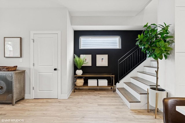 foyer with stairway and light wood-type flooring