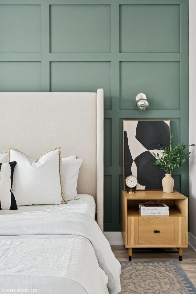 bedroom with wood finished floors