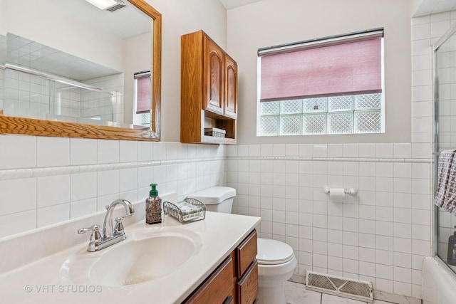 6223 S Rutherford Ave, Chicago, IL 60638 - full bathroom with visible vents, tile walls, a shower with shower door, vanity, and toilet