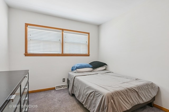 6223 S Rutherford Ave, Chicago, IL 60638 - carpeted bedroom with baseboards, visible vents, and multiple windows