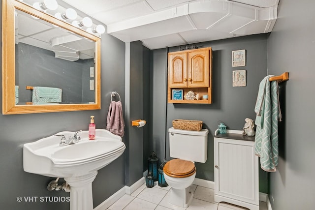 6223 S Rutherford Ave, Chicago, IL 60638 - half bath featuring baseboards, tile patterned flooring, and toilet