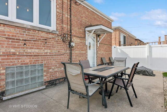 6223 S Rutherford Ave, Chicago, IL 60638 - view of patio / terrace featuring outdoor dining area and fence