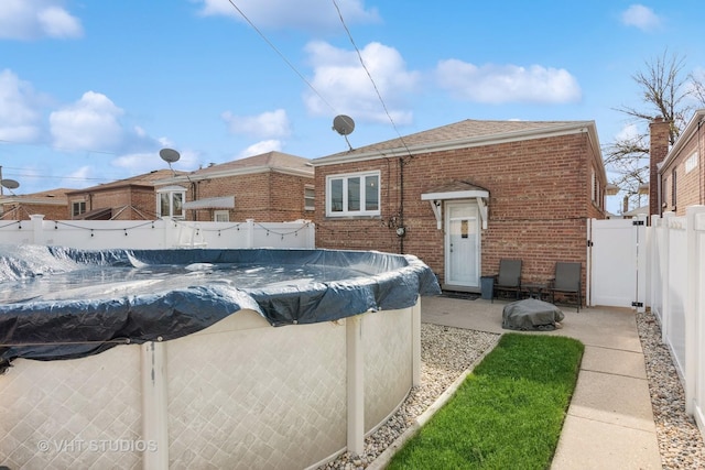 6223 S Rutherford Ave, Chicago, IL 60638 - view of swimming pool with a fenced in pool, a fenced backyard, and a gate