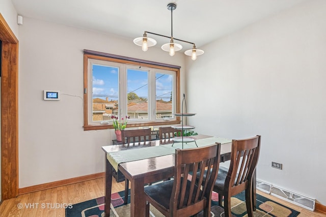 6223 S Rutherford Ave, Chicago, IL 60638 - dining area with visible vents, light wood-style flooring, and baseboards