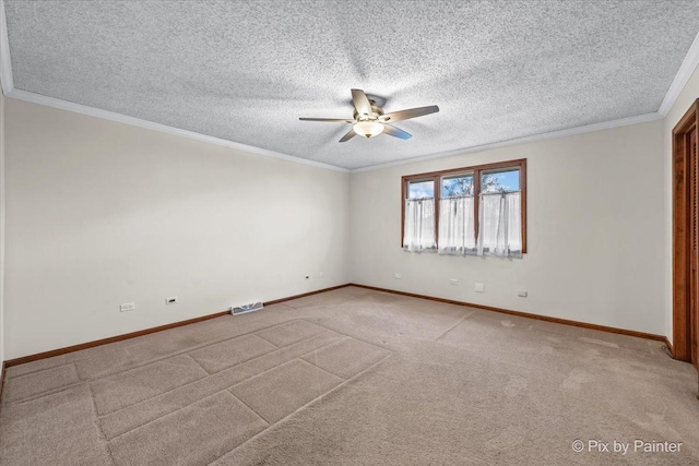 unfurnished room with baseboards, ornamental molding, a ceiling fan, and a textured ceiling