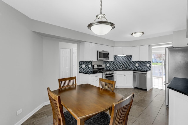 dining room featuring baseboards