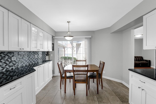 dining space with baseboards