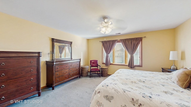 bedroom with multiple windows, light carpet, and visible vents