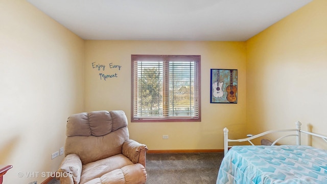 carpeted bedroom featuring baseboards