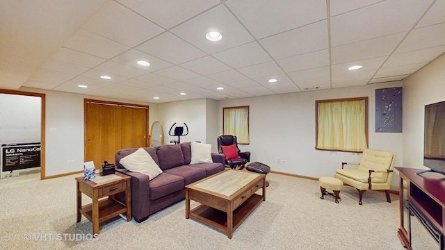 living room with carpet floors, recessed lighting, baseboards, and a paneled ceiling
