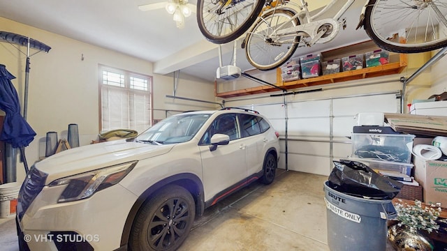 garage featuring a ceiling fan and a garage door opener