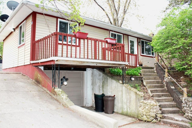 exterior space featuring stairs and a garage