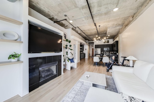 living area with wood finished floors and a fireplace