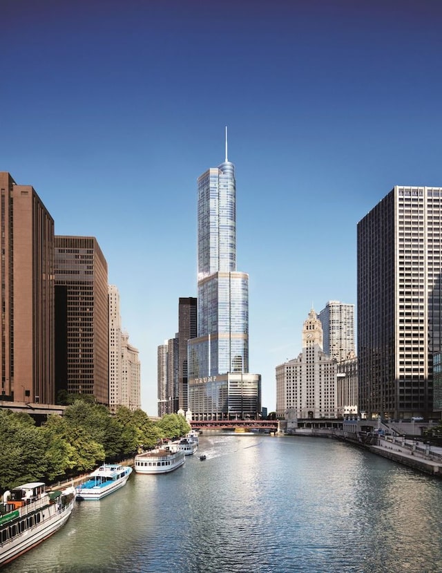 property's view of city featuring a water view