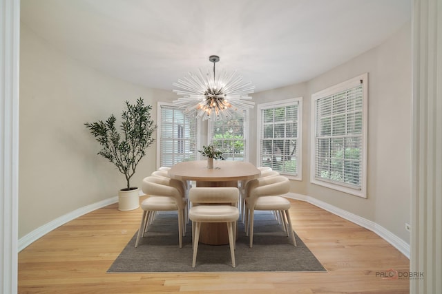 590 Academy Woods Dr, Lake Forest, IL 60045 - dining space featuring a chandelier and light wood finished floors