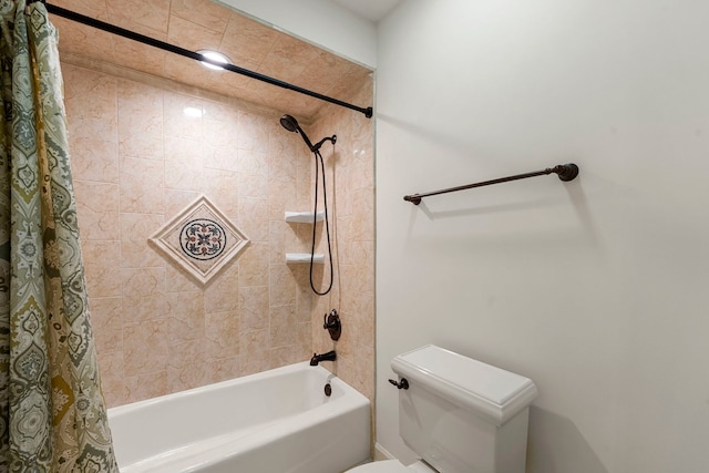 bathroom featuring shower / tub combo and toilet