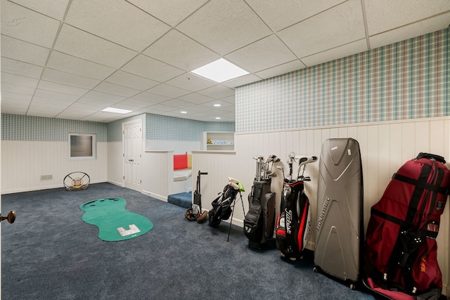 game room with a paneled ceiling, wainscoting, carpet, wallpapered walls, and baseboards