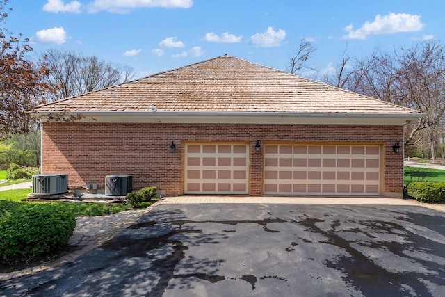 view of home's exterior featuring brick siding and central air condition unit