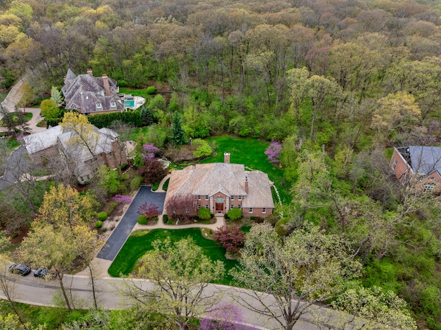 aerial overview of property's location featuring a heavily wooded area