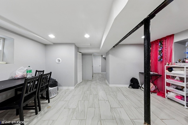 interior space featuring baseboards and recessed lighting
